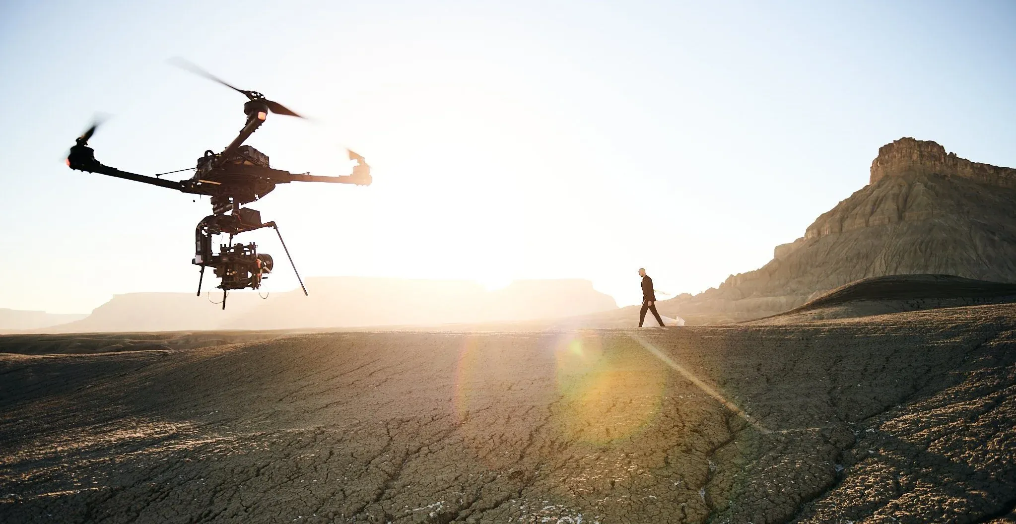 Freefly ALTA X drone silhouetted at sunrise over a Utah canyon rim